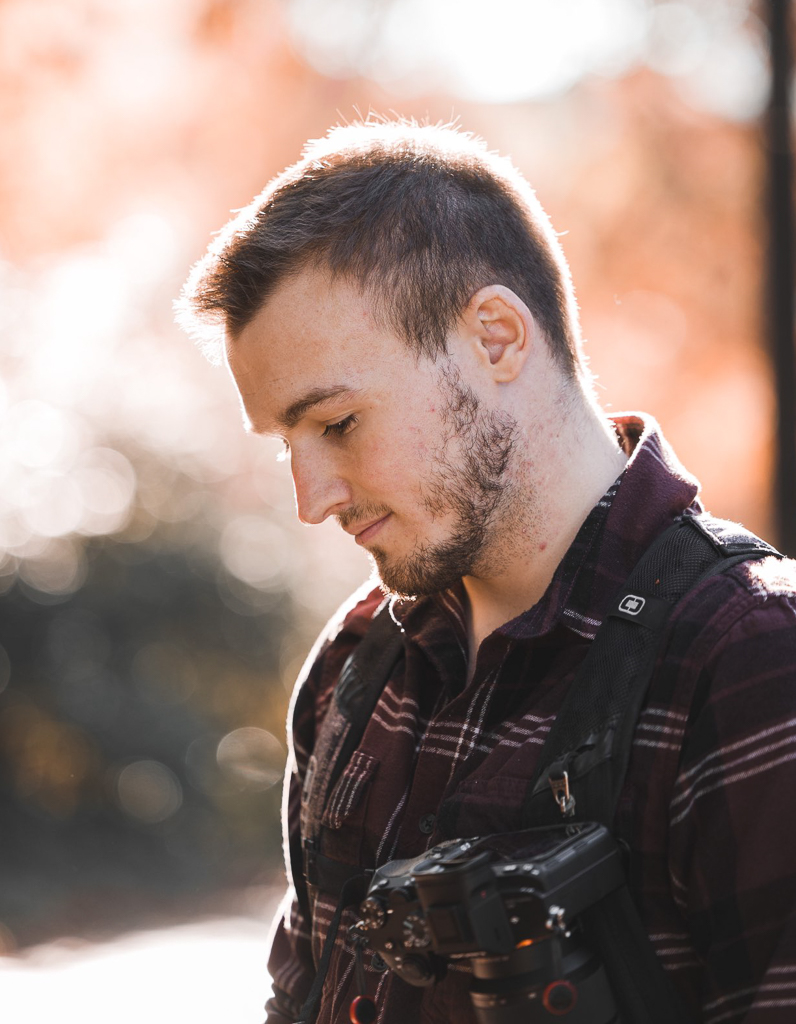 Profile of Jay Remmers with an autumn colored bokeh background