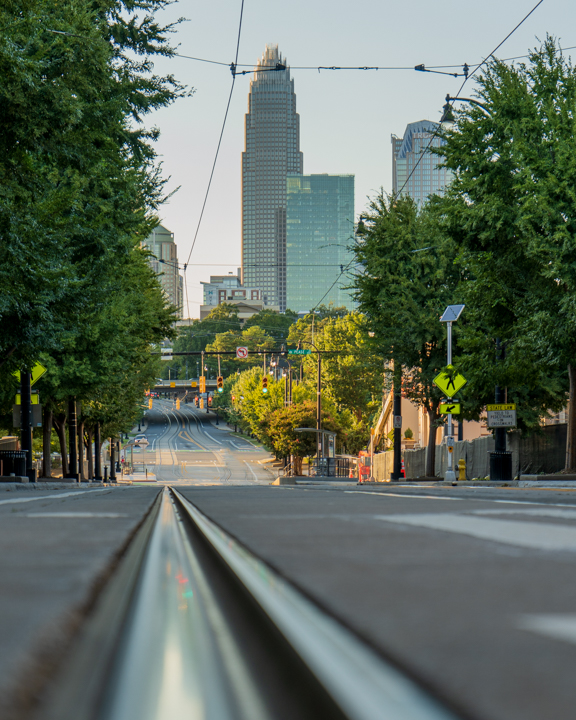 View of Charlotte's skyline from along a lightrail track on Elizabeth Ave