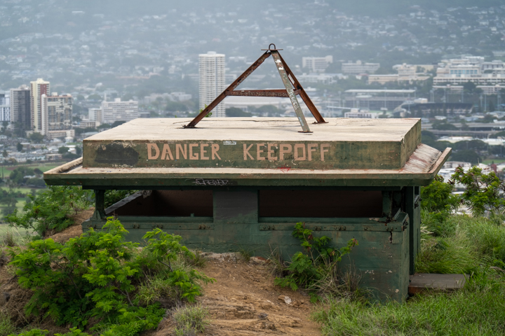 A building tagged with graffiti saying Danger Keep Off