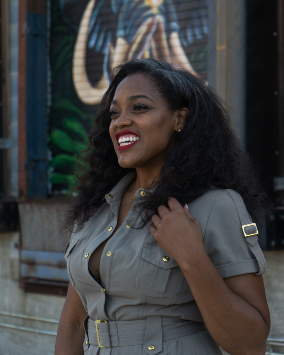 Woman smiling and touching her hair